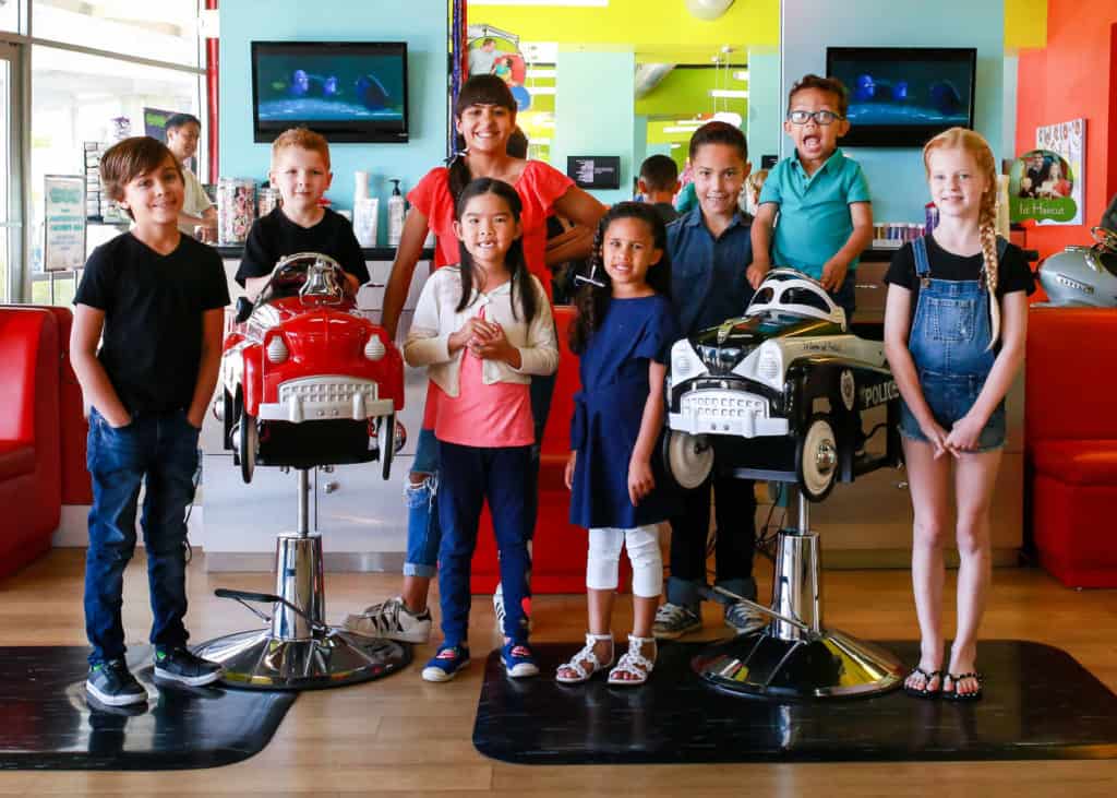 another group shot of happy kids at pigtails & crewcuts children's hair salon franchise